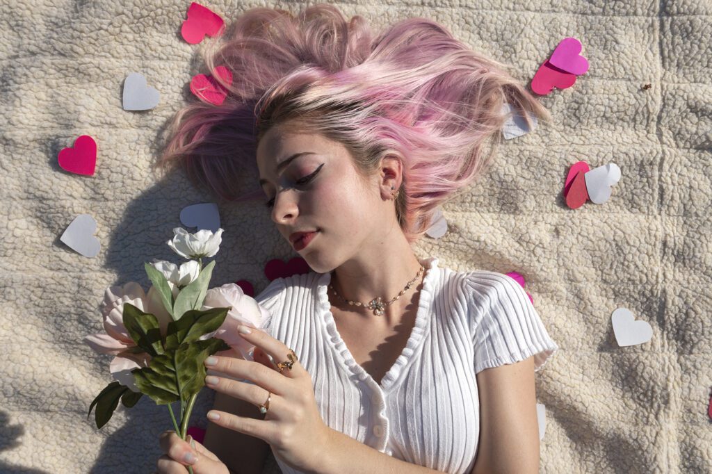 Natalie laying down with flowers