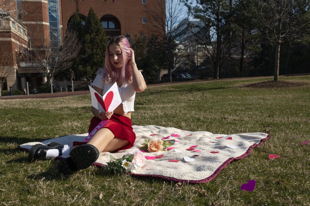 Natalie sitting and reading a card