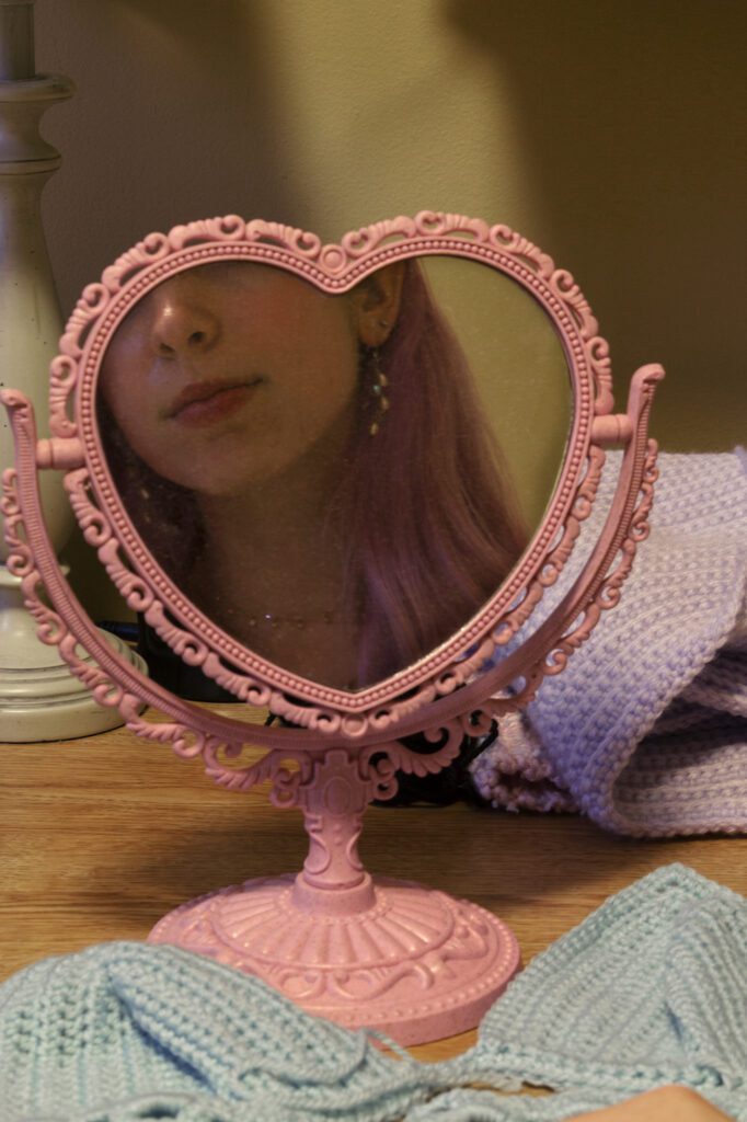 Natalie's reflection in a heart mirror