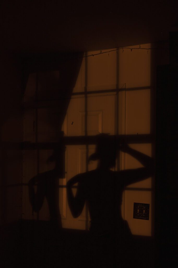 me posing in shadow of window